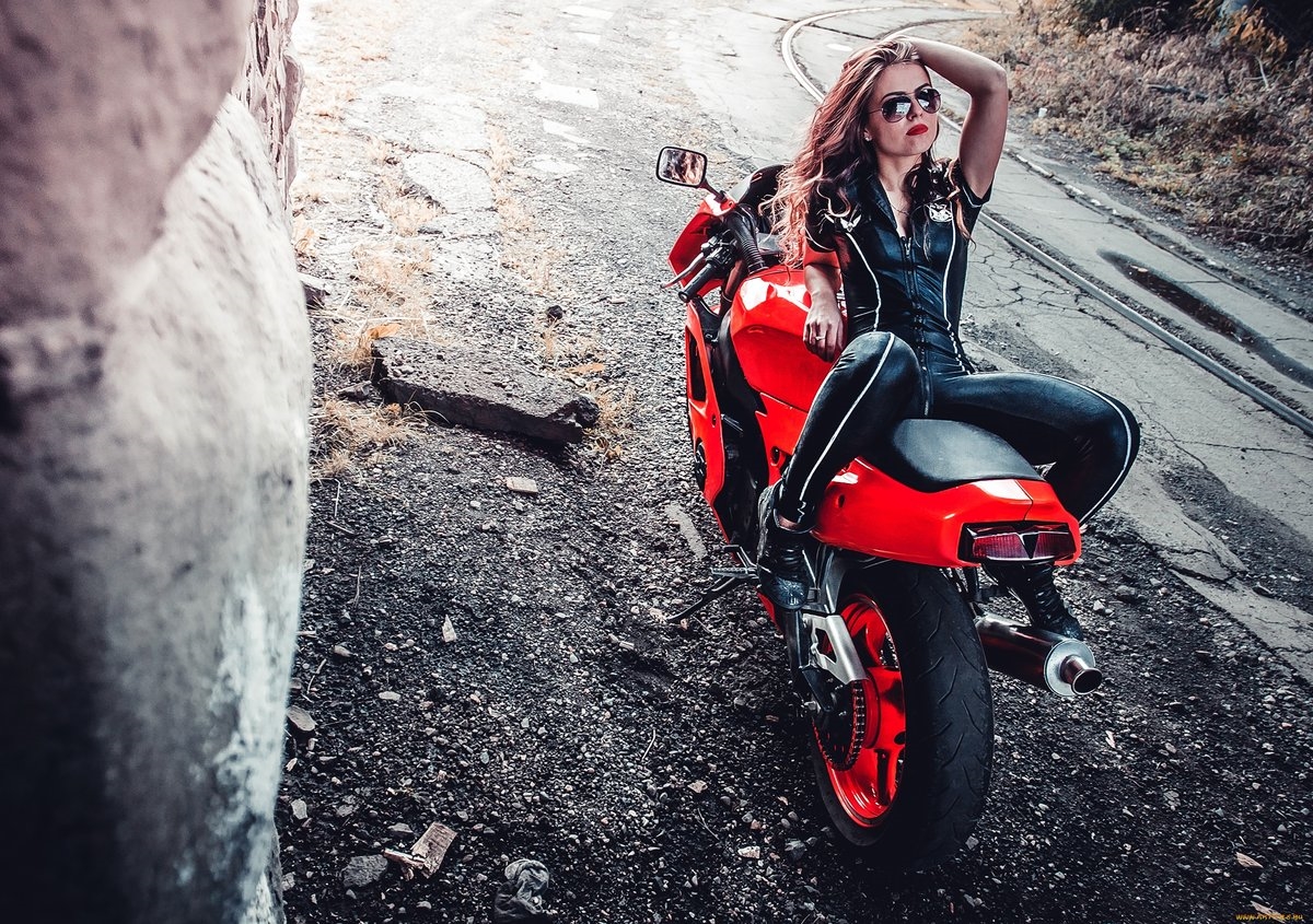 Blondes on a motorcycle in Nassau